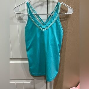 Turquoise women’s workout tank built-in shelf